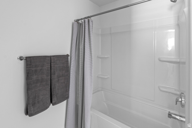 1264 West 500 South, Unit 320 Logan, UT 84321 - Photo 18 of 39 Bright white tub/shower combination with integrated shelving
