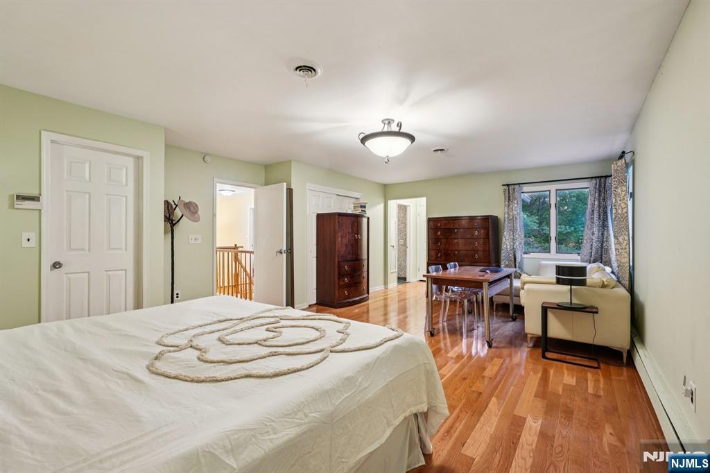 47 Matthew Road Wayne, NJ 07470 - Photo 15 of 25 a bed room with a bed and furniture