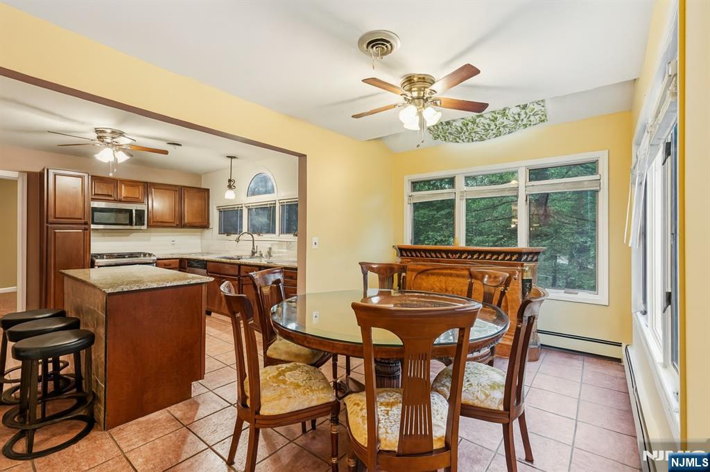 47 Matthew Road Wayne, NJ 07470 - Photo 9 of 25 a dining room with furniture and window