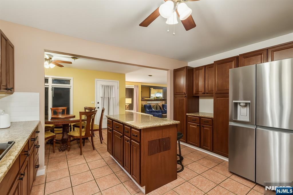 47 Matthew Road Wayne, NJ 07470 - Photo 10 of 25 a kitchen with stainless steel appliances granite countertop a refrigerator and a stove top oven