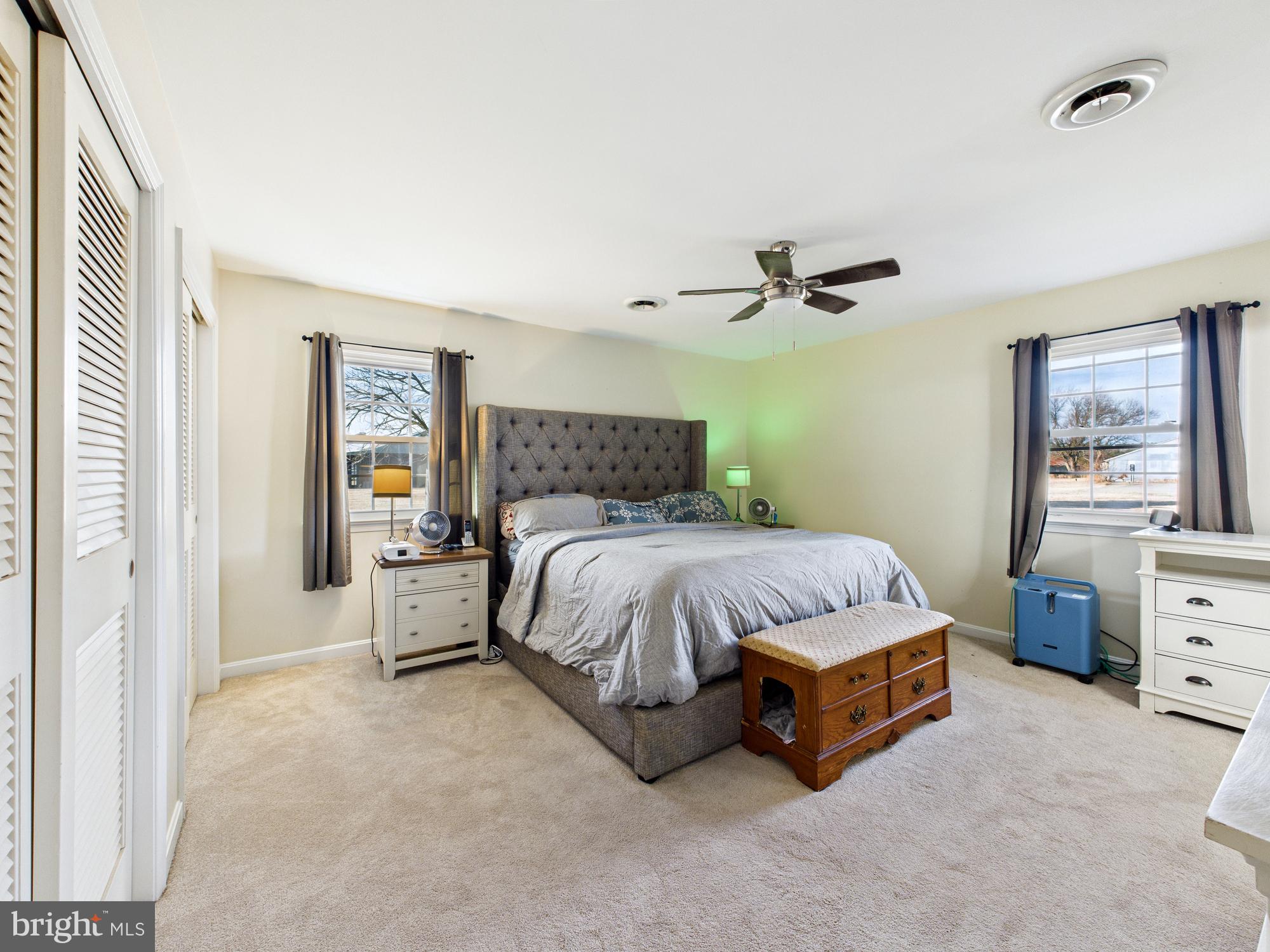 28964 Waller Road Delmar, MD 21875 - Photo 14 of 44 a spacious bedroom with a bed and window