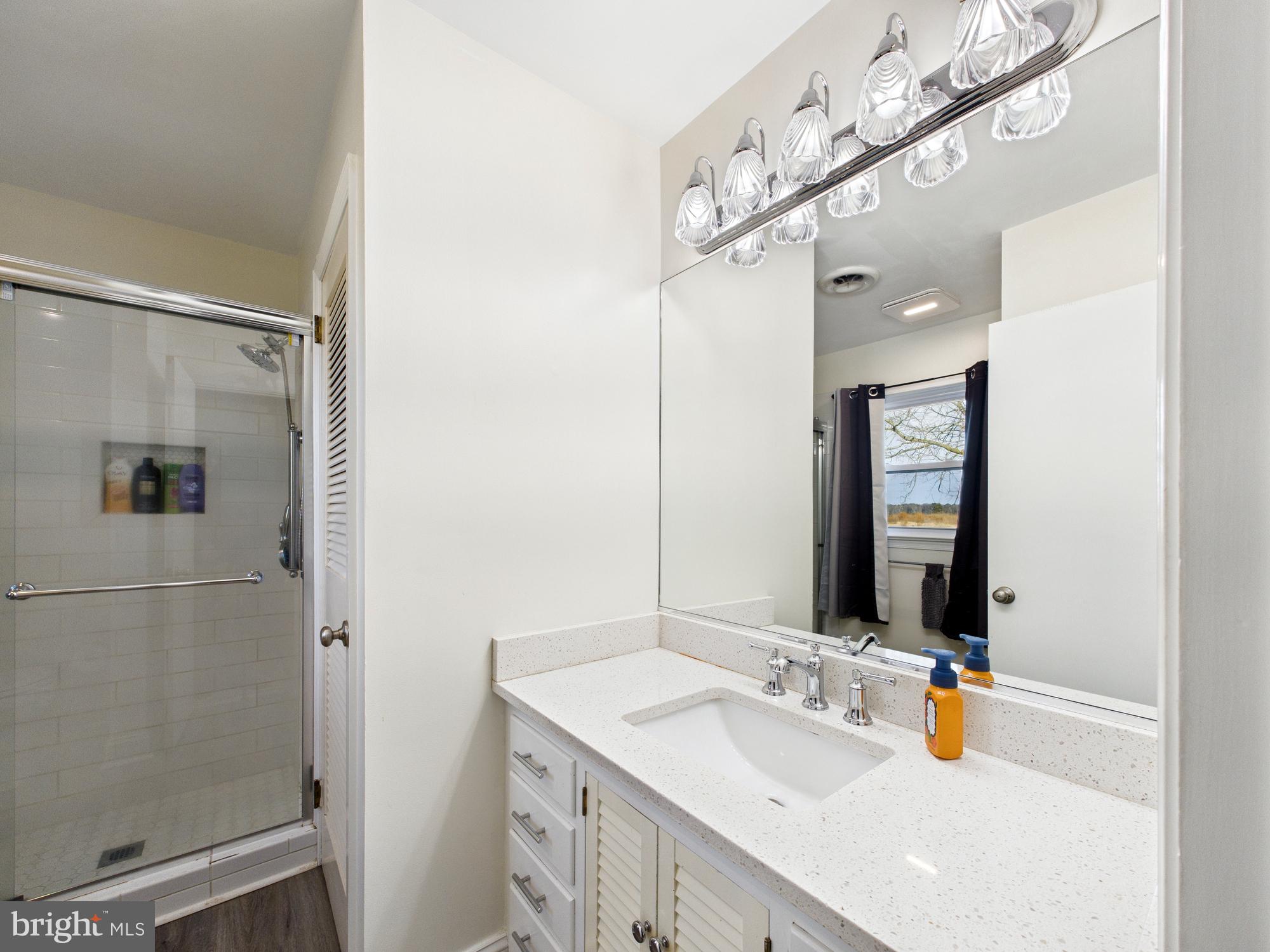 28964 Waller Road Delmar, MD 21875 - Photo 17 of 44 a bathroom with a sink vanity and mirror