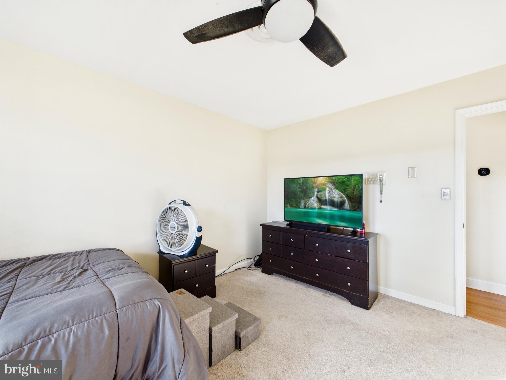 28964 Waller Road Delmar, MD 21875 - Photo 20 of 44 a bed room with a bed and a television
