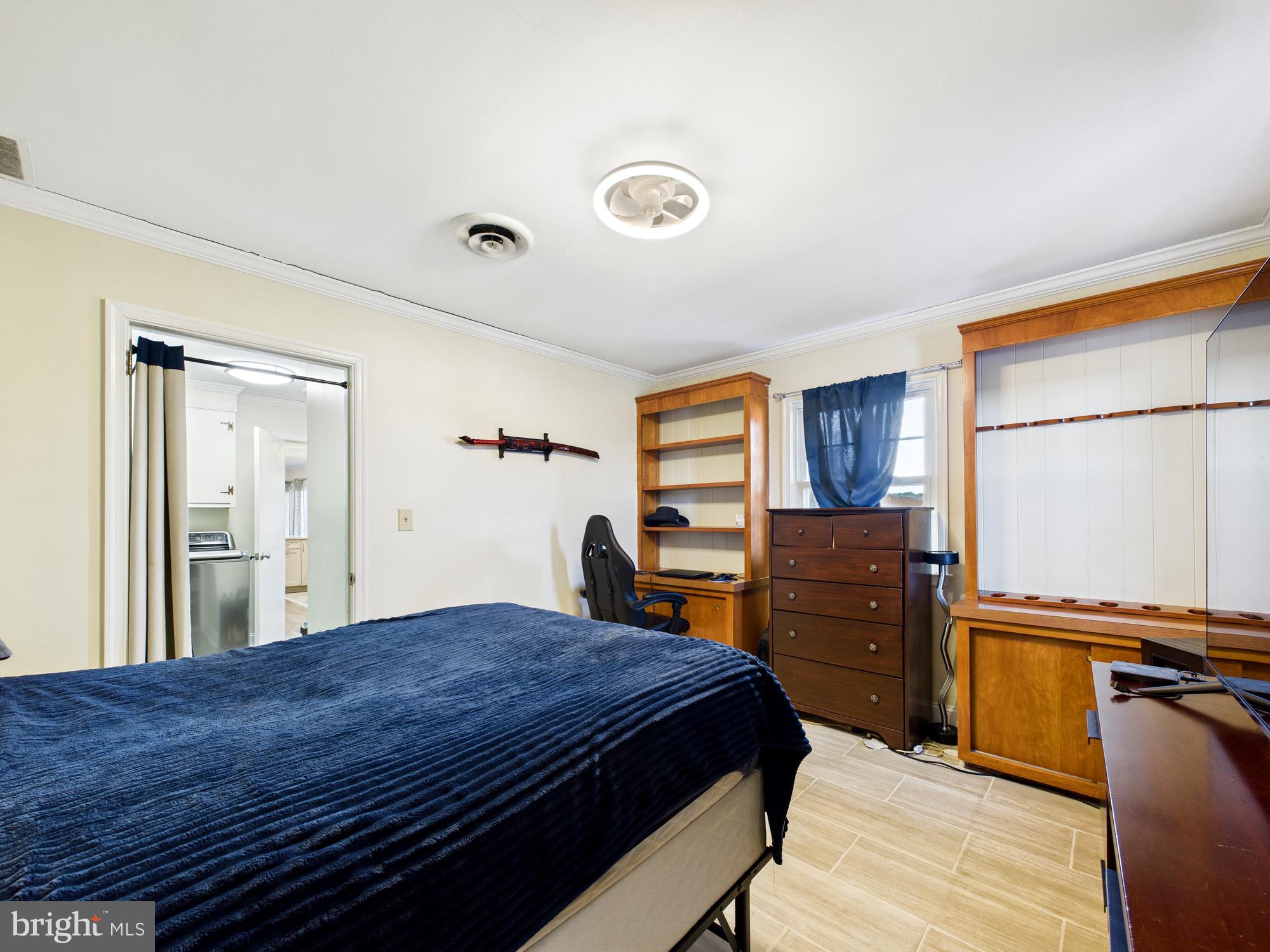 28964 Waller Road Delmar, MD 21875 - Photo 23 of 44 a bedroom with a bed and wooden floor