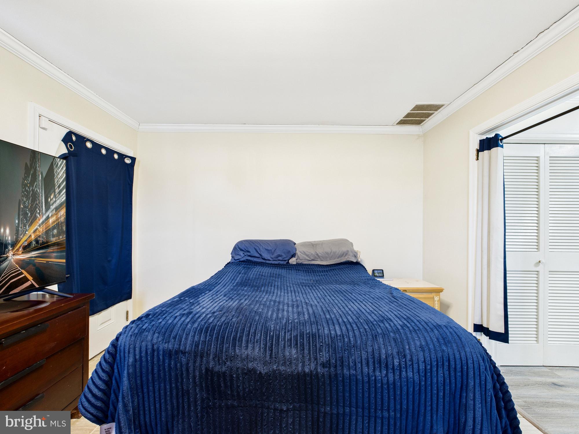 28964 Waller Road Delmar, MD 21875 - Photo 25 of 44 a bedroom with a bed and a dresser