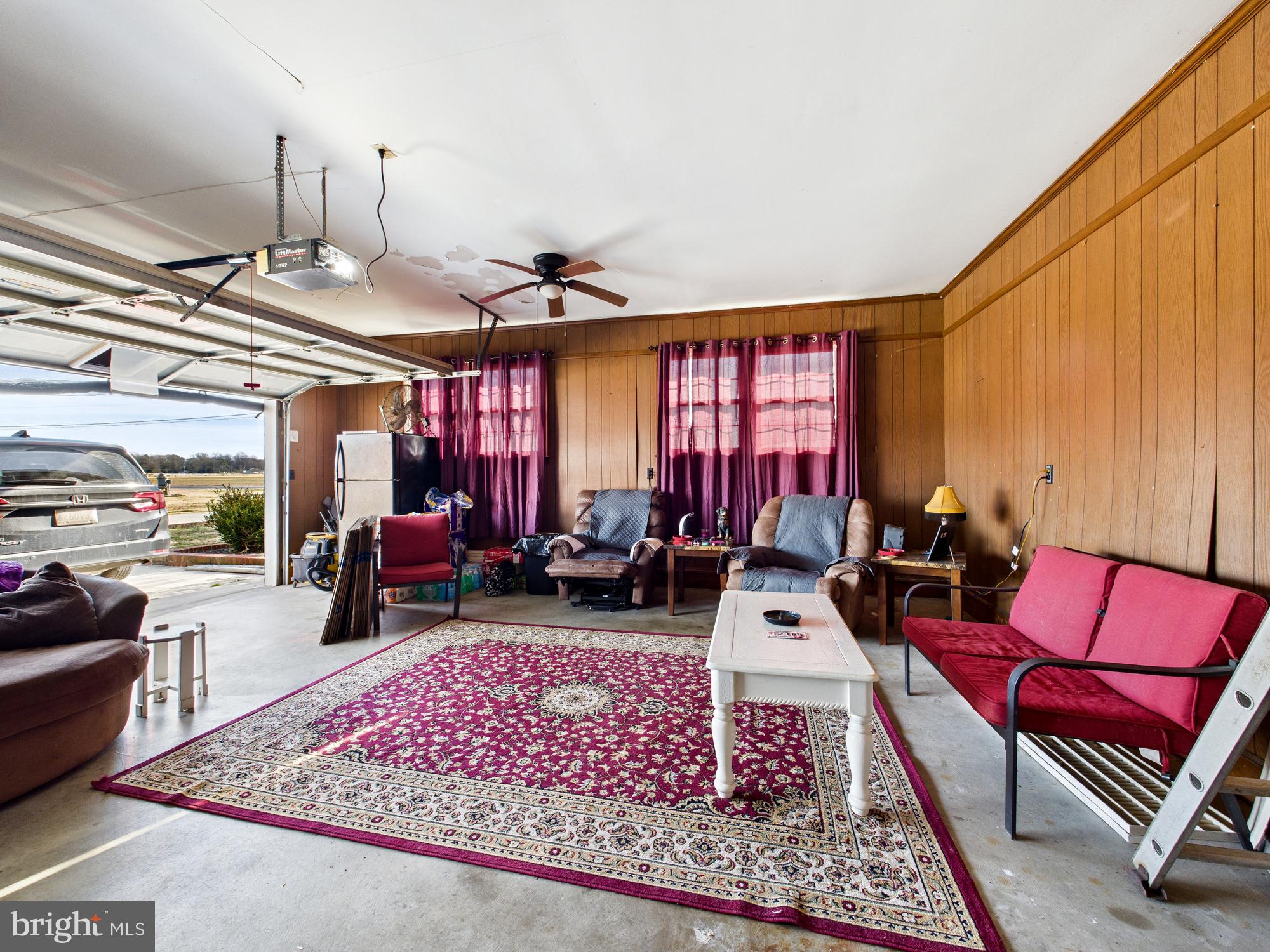 28964 Waller Road Delmar, MD 21875 - Photo 29 of 44 a living room with furniture a rug and a window