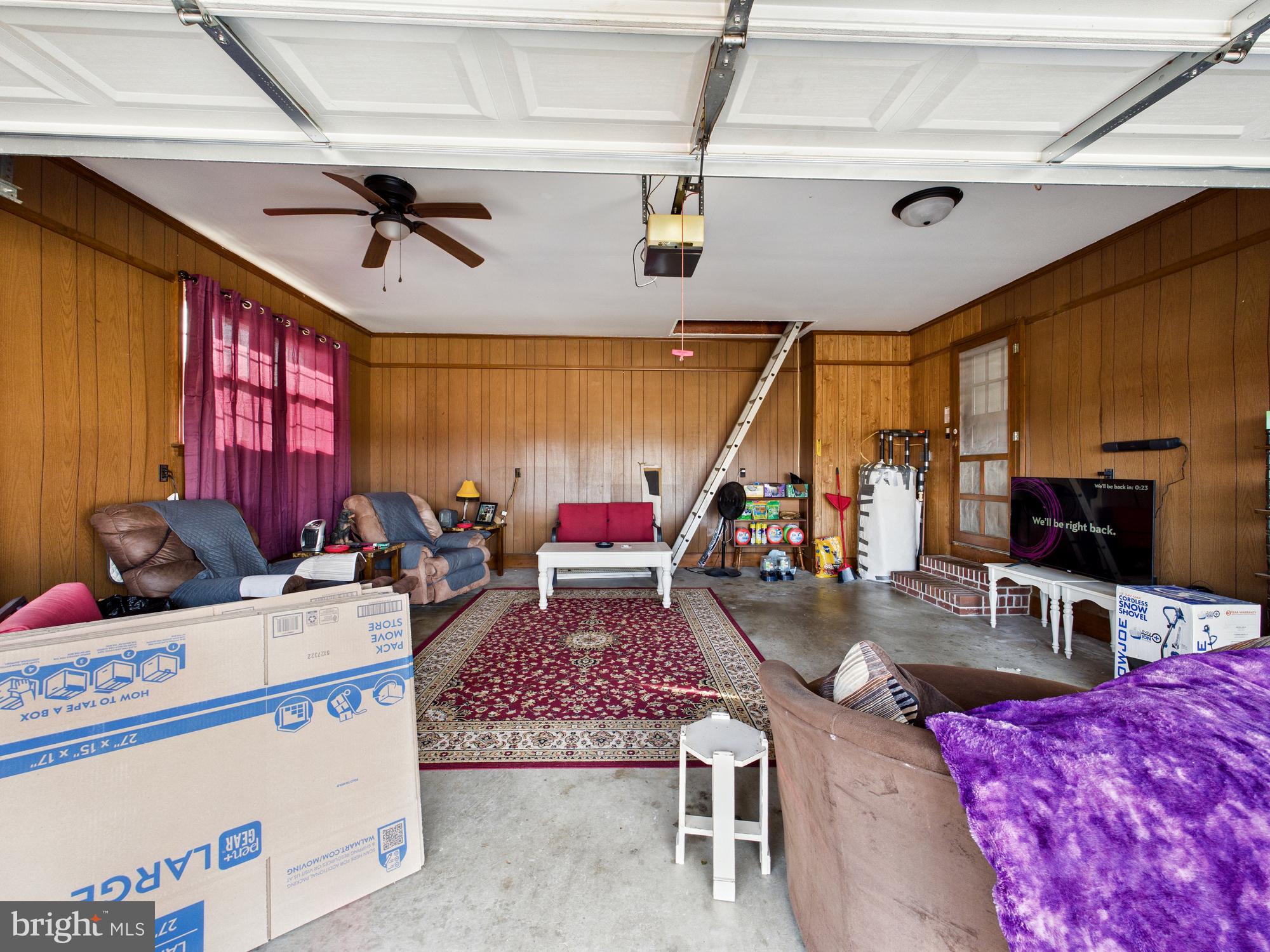 28964 Waller Road Delmar, MD 21875 - Photo 30 of 44 a living room with furniture and a flat screen tv