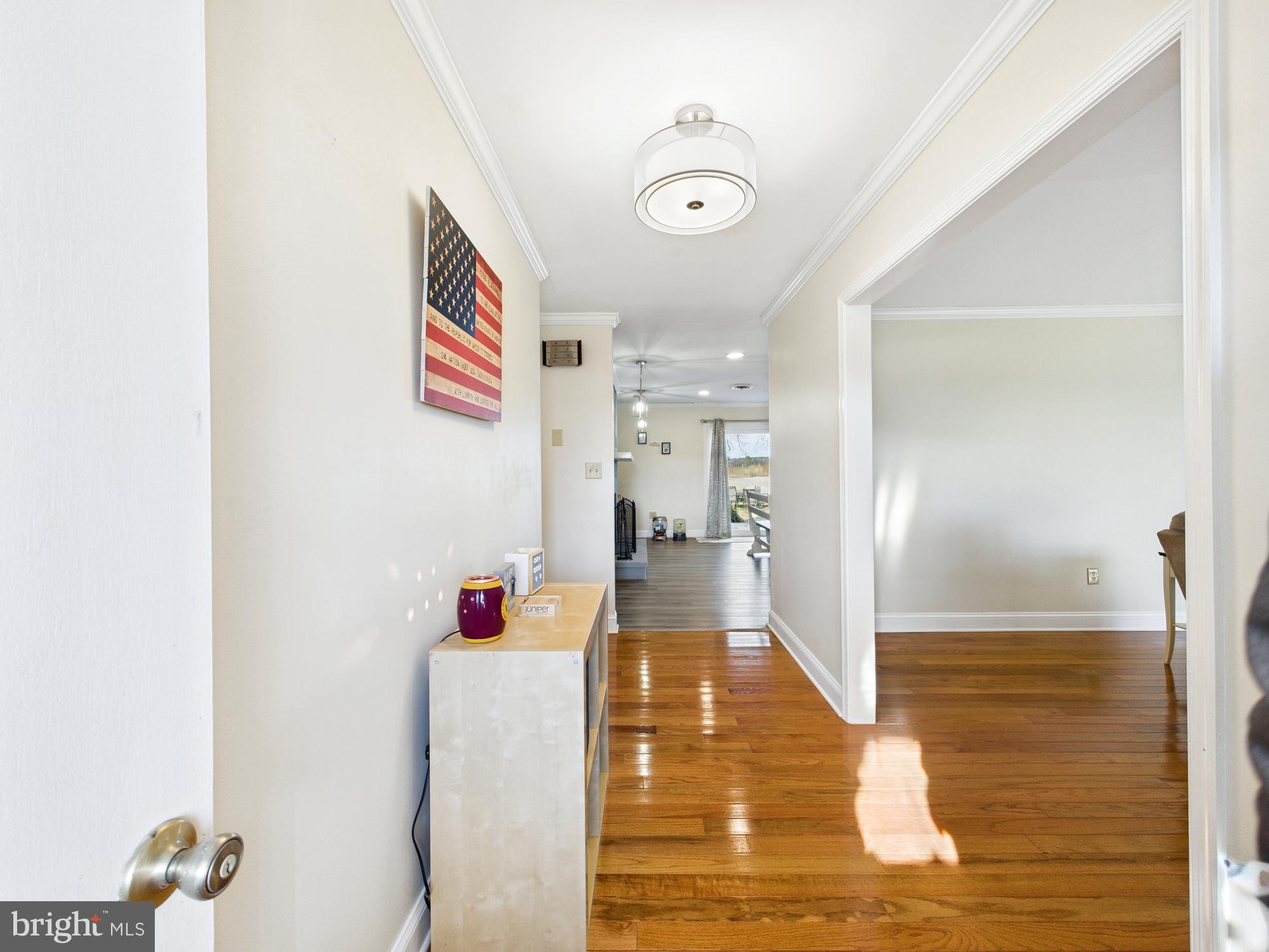 28964 Waller Road Delmar, MD 21875 - Photo 3 of 44 a view of a hallway with wooden floor and staircase