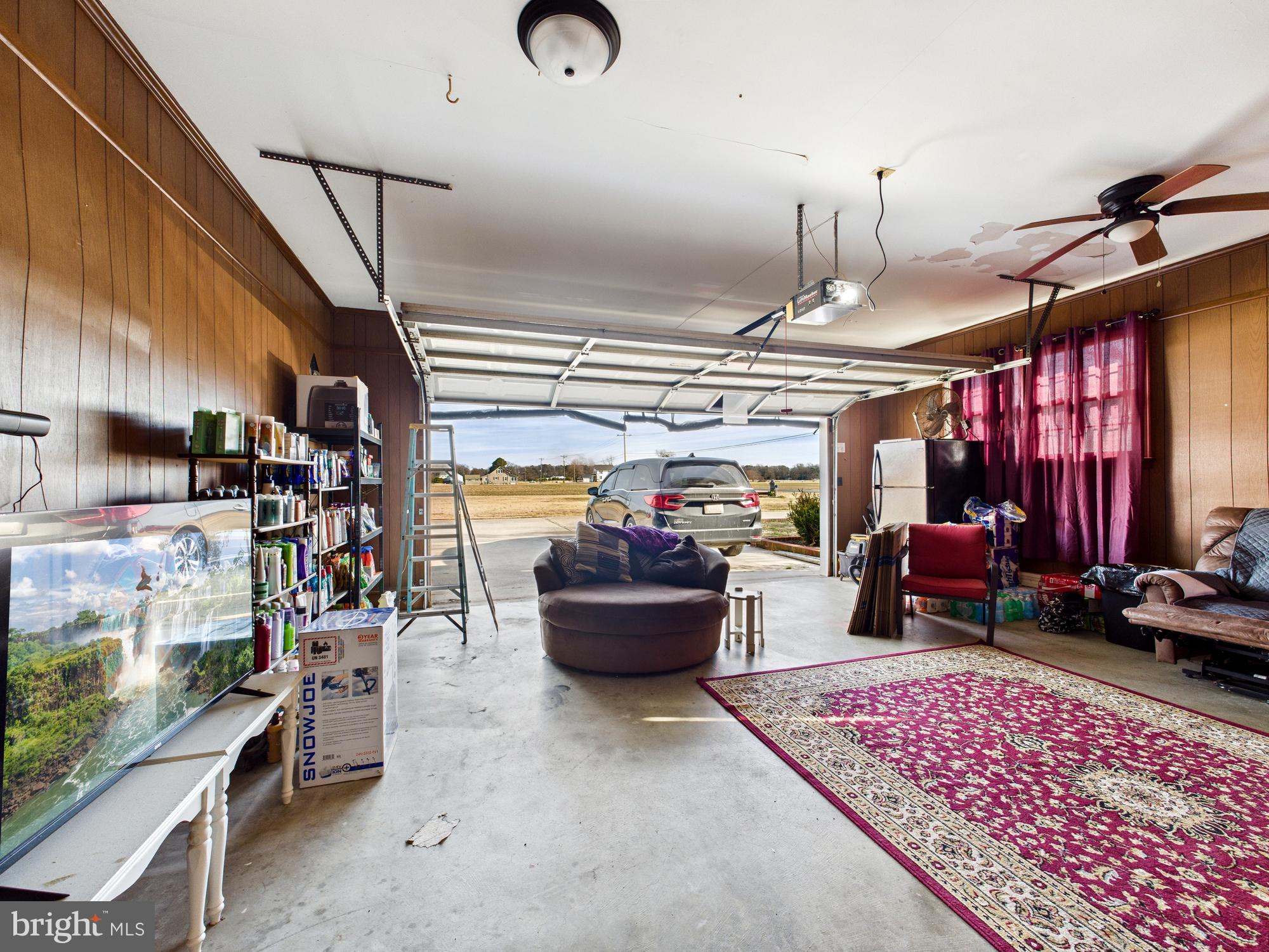 28964 Waller Road Delmar, MD 21875 - Photo 31 of 44 a living room with furniture and a chandelier
