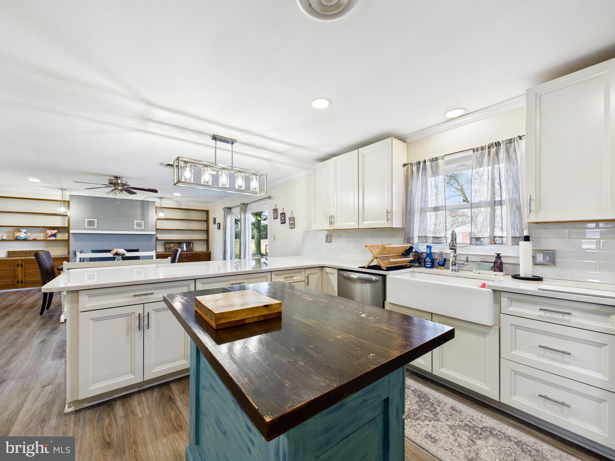 28964 Waller Road Delmar, MD 21875 - Photo 9 of 44 a kitchen with a sink a stove a refrigerator and white cabinets