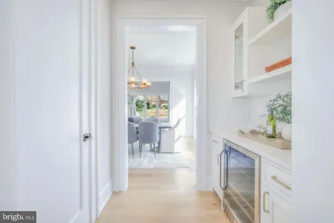 a living room with furniture a fireplace and a potted plant