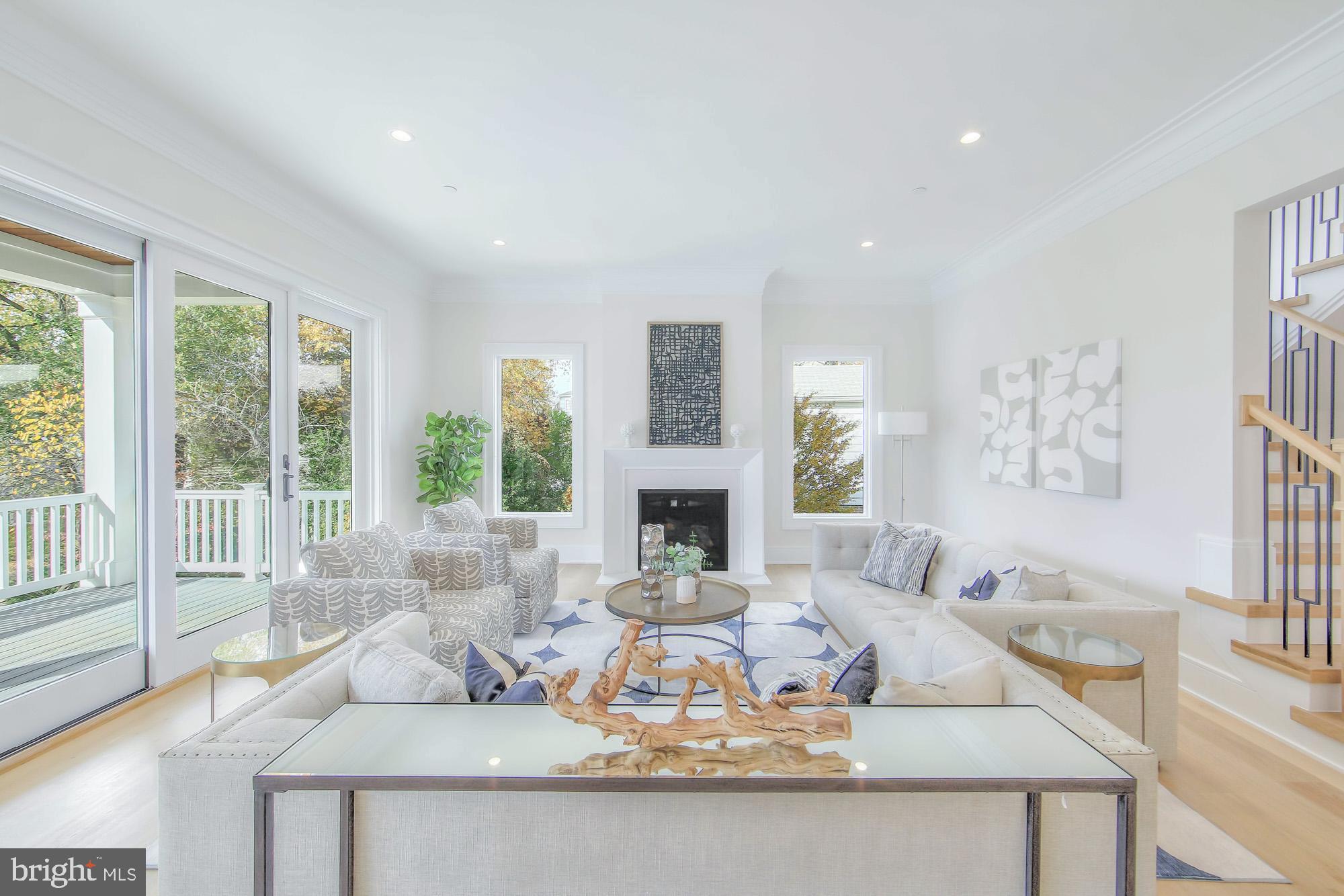 6012 Sonoma Road Bethesda, MD 20817 - Photo 16 of 57 a living room with fireplace furniture and a large window