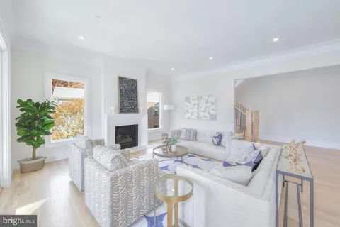 a spacious bedroom with a large bed and a chandelier