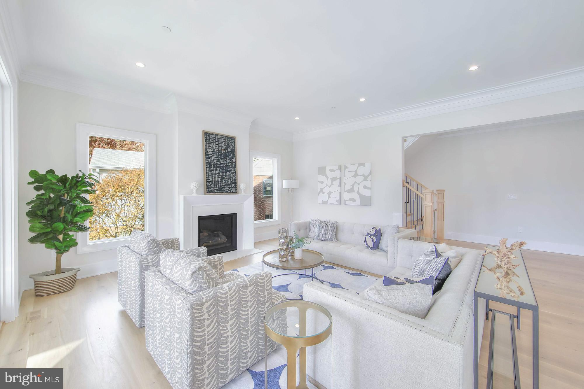 6012 Sonoma Road Bethesda, MD 20817 - Photo 17 of 57 a living room with furniture a fireplace and a potted plant