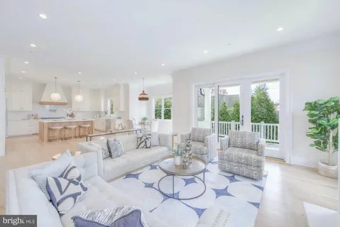 a spacious bedroom with a bed and a dresser