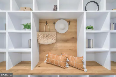 a spacious bedroom with a bed and a cabinets