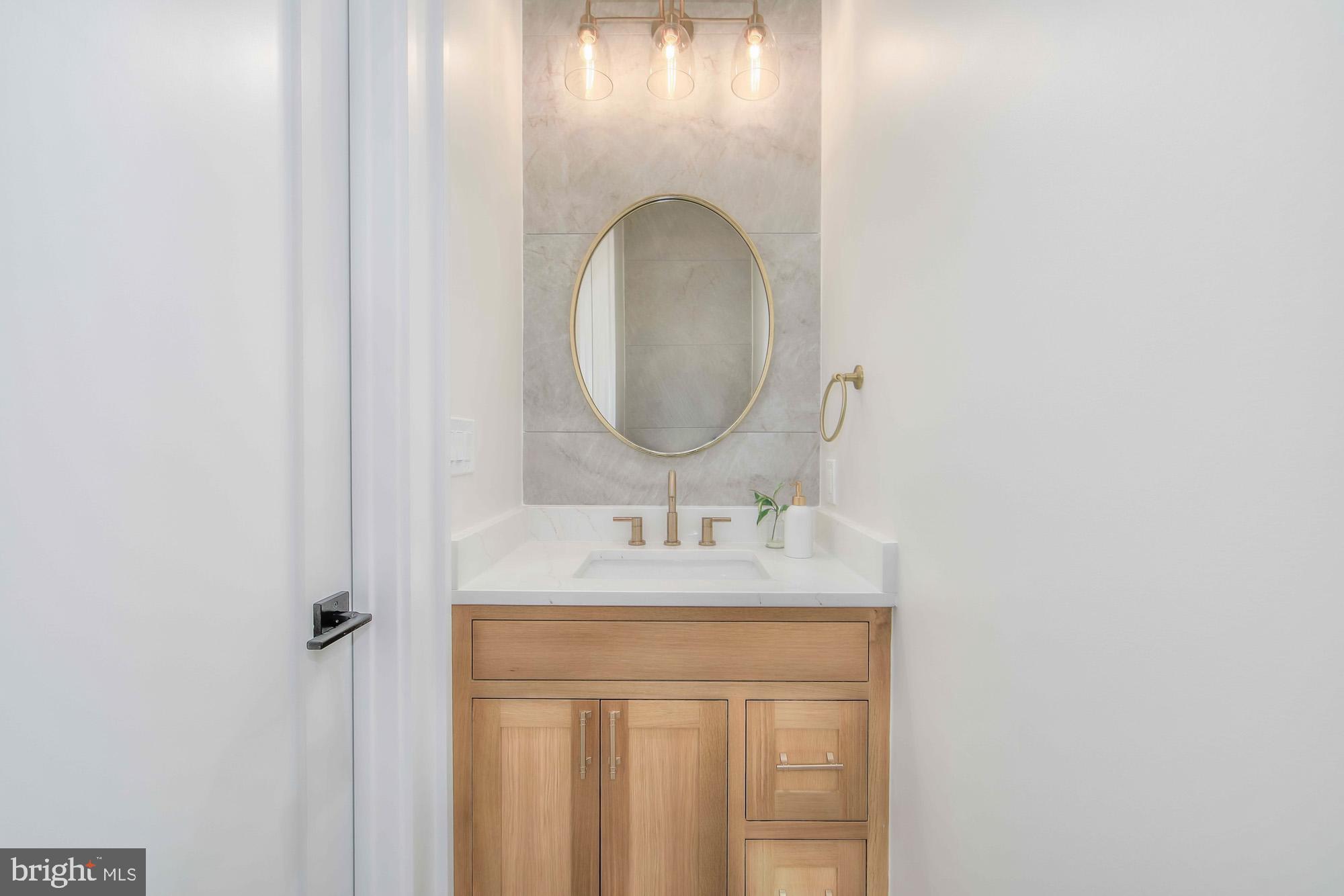6012 Sonoma Road Bethesda, MD 20817 - Photo 20 of 57 a bathroom with a sink and a mirror