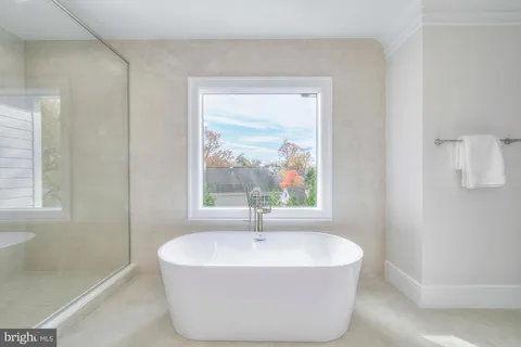 a bathroom with a toilet sink and shower