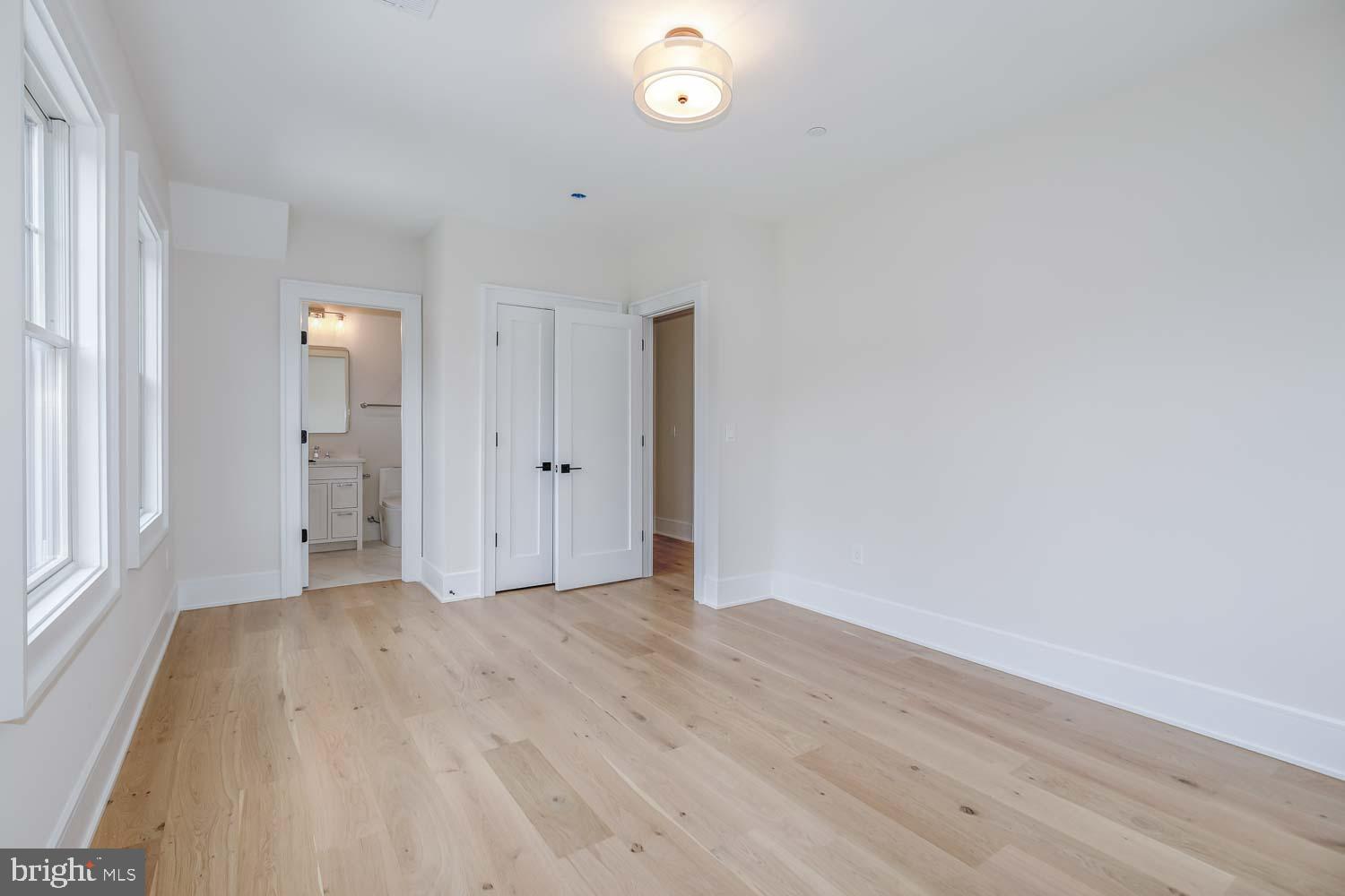 6012 Sonoma Road Bethesda, MD 20817 - Photo 29 of 57 a view of an empty room with window and wooden floor