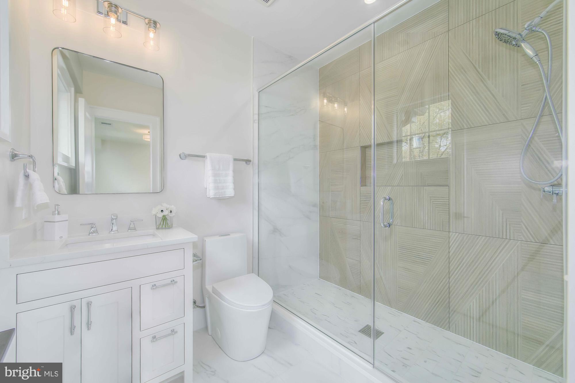 6012 Sonoma Road Bethesda, MD 20817 - Photo 30 of 57 a bathroom with a toilet sink and shower