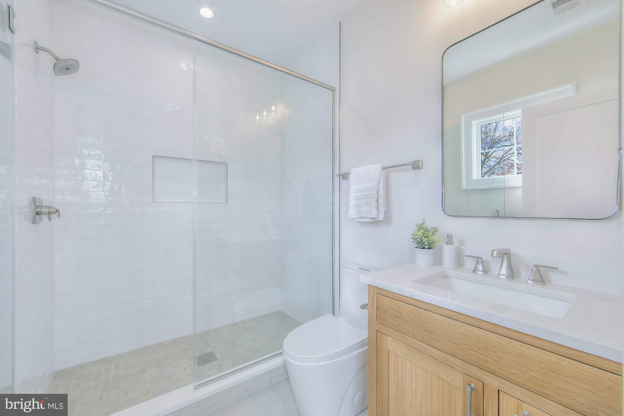 6012 Sonoma Road Bethesda, MD 20817 - Photo 33 of 57 a bathroom with a sink toilet and shower