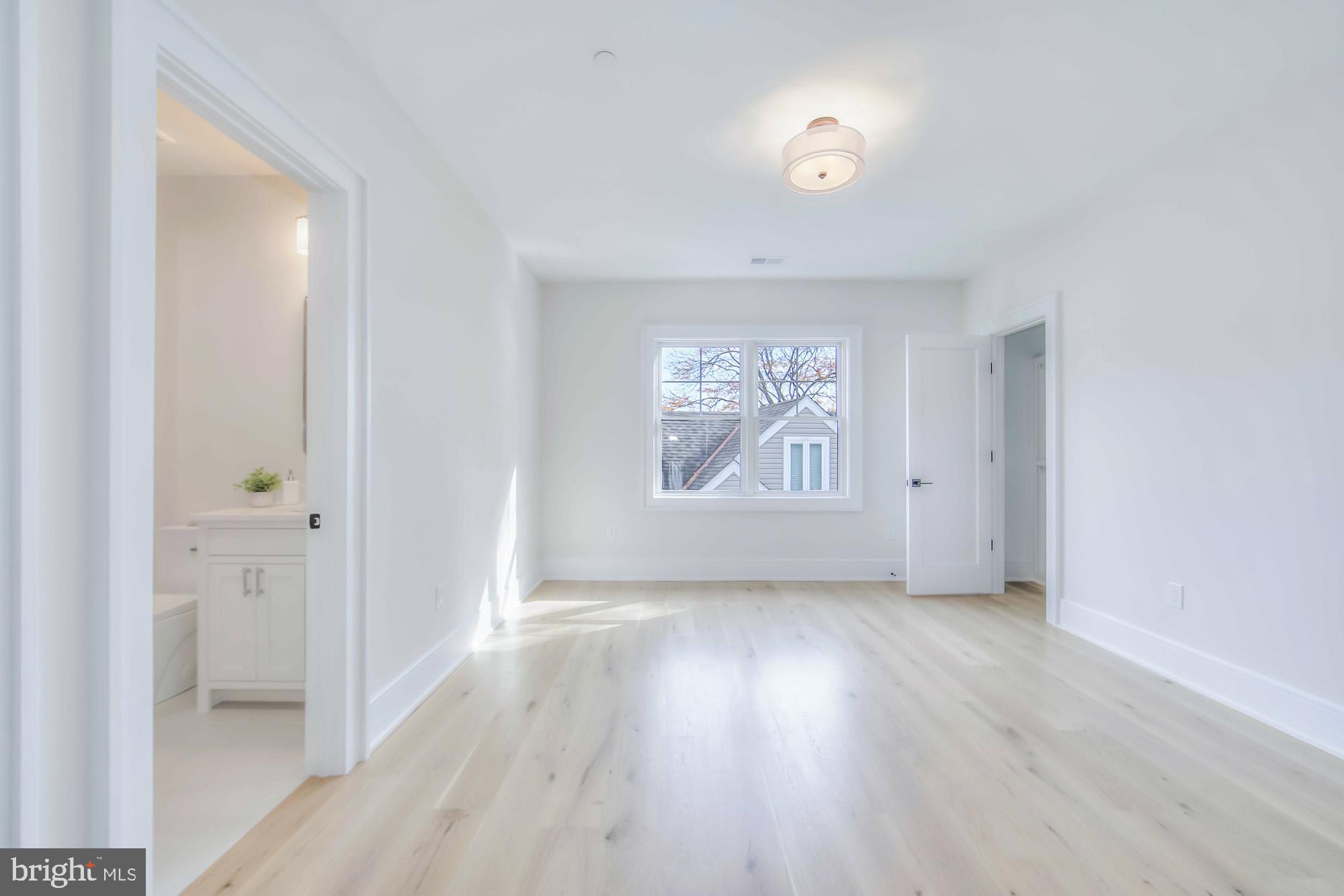 6012 Sonoma Road Bethesda, MD 20817 - Photo 34 of 57 wooden floor in an empty room with a window