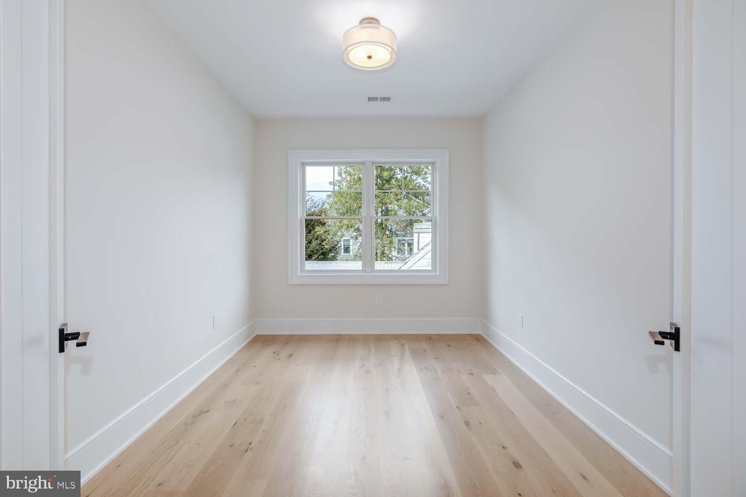 6012 Sonoma Road Bethesda, MD 20817 - Photo 37 of 57 a view of room with window and hardwood floor