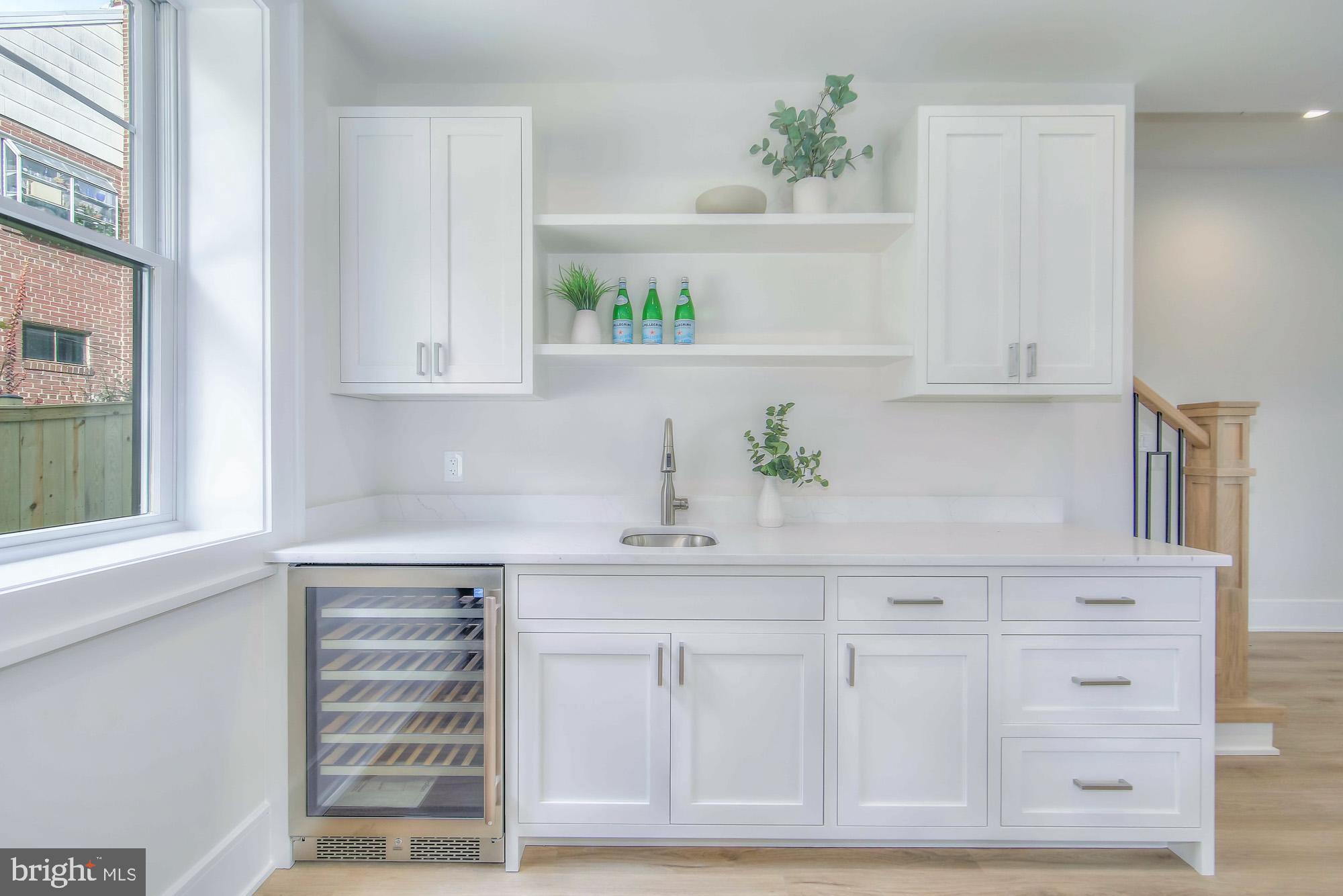 6012 Sonoma Road Bethesda, MD 20817 - Photo 39 of 57 a kitchen with white cabinets and a window