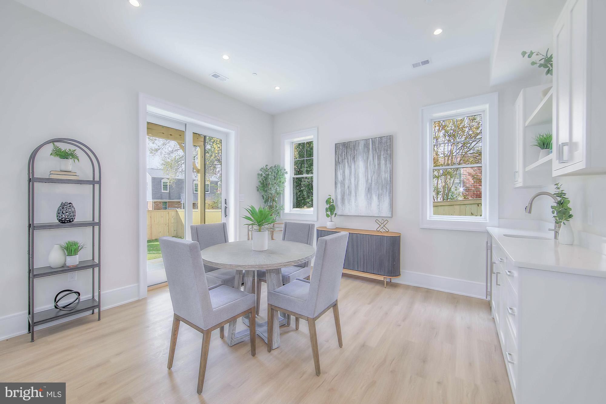 6012 Sonoma Road Bethesda, MD 20817 - Photo 40 of 57 a view of a dining room with furniture window and wooden floor