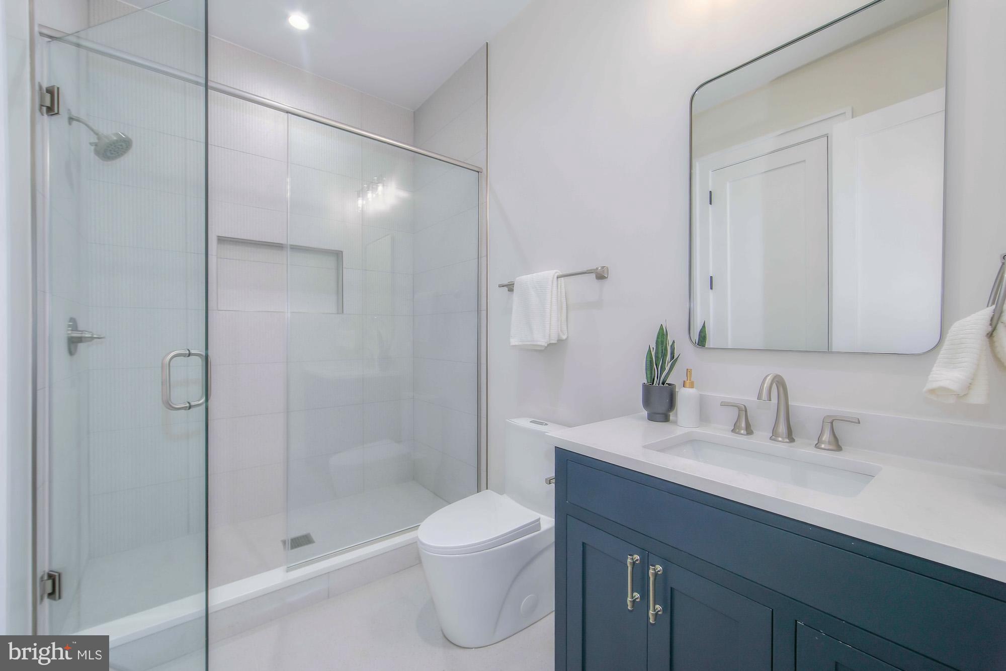 6012 Sonoma Road Bethesda, MD 20817 - Photo 45 of 57 a bathroom with a sink a toilet and shower