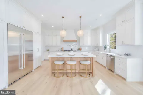 a kitchen with a sink cabinets and window