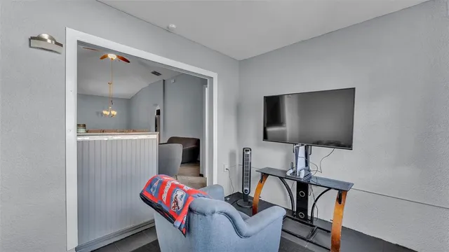 a kitchen with granite countertop a sink stove and cabinets