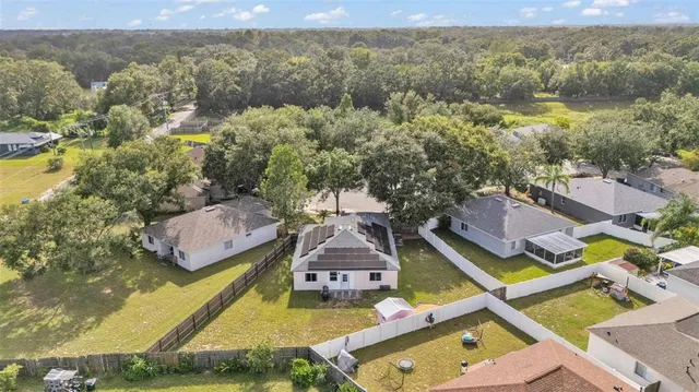 an aerial view of houses with yard