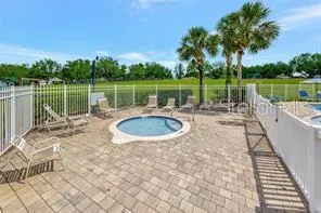 a view of a swimming pool with a patio