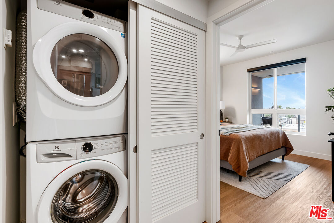 10601 Washington Boulevard, Unit 428 Culver City, CA 90232 - Photo 11 of 29 a view of a bedroom with washer and dryer