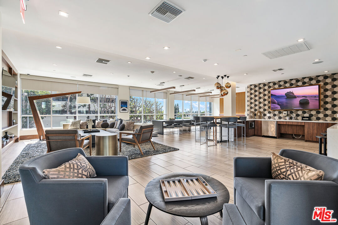 10601 Washington Boulevard, Unit 428 Culver City, CA 90232 - Photo 24 of 29 a living room with furniture and a view of kitchen