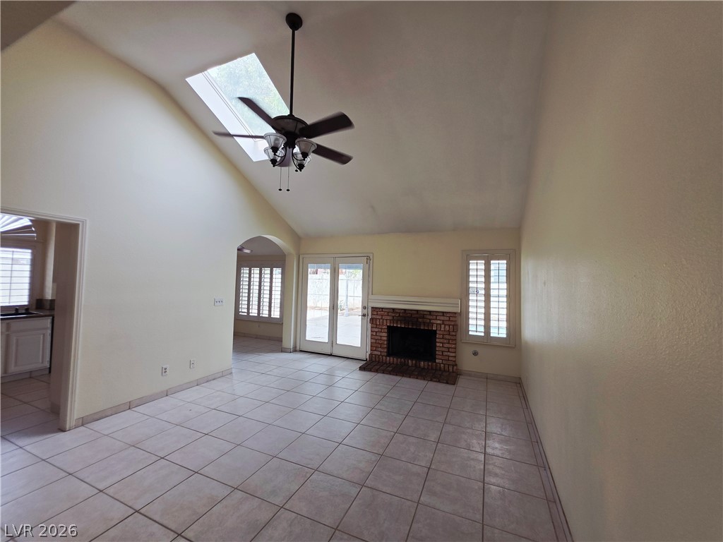 2920 Setting Sun Street Las Vegas, NV 89117 - Photo 21 of 43 This bright living space features a cozy fireplace and vaulted ceilings.