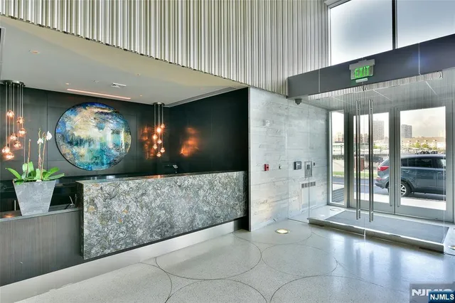 a living room with furniture and potted plant
