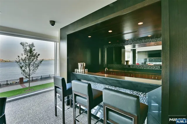 a view of a living room and entryway