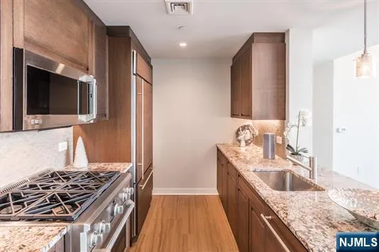 a kitchen with a stove and a sink