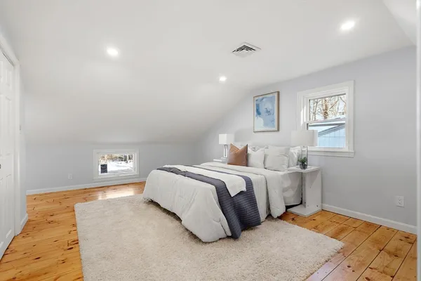 a bed room with a bed and a night stand