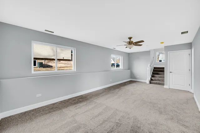 a view of empty room with windows