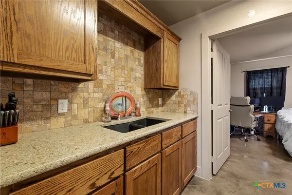 a kitchen with sink cabinets and window