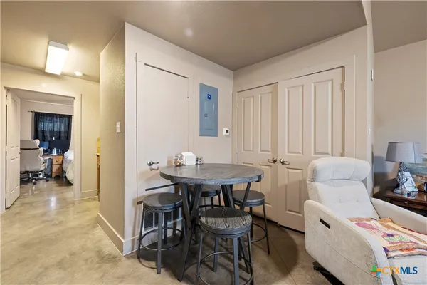 a view of a livingroom with furniture and a window