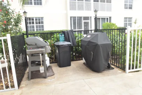 a view of a chairs and tables in the roof deck
