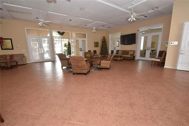 a view of a livingroom with kitchen and furniture
