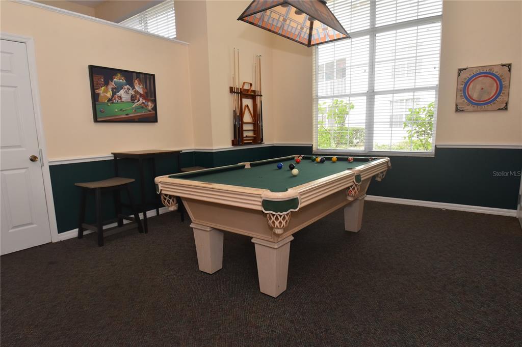 4235 Castle Bridge, Unit 1216 Sarasota, FL 34238 - Photo 16 of 18 a room with pool table and windows