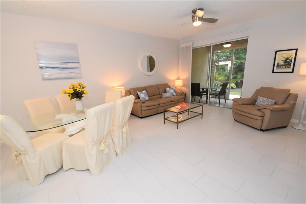 4235 Castle Bridge, Unit 1216 Sarasota, FL 34238 - Photo 4 of 18 a living room with furniture and a large window