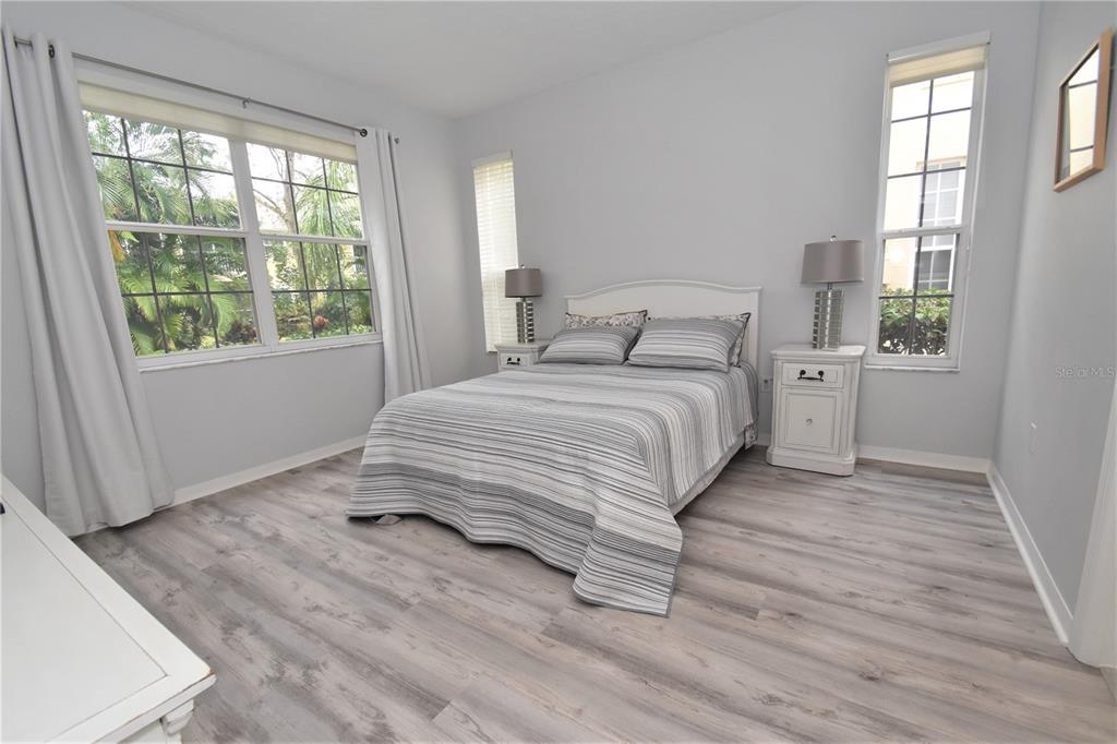 4235 Castle Bridge, Unit 1216 Sarasota, FL 34238 - Photo 6 of 18 a bedroom with a bed and a large window