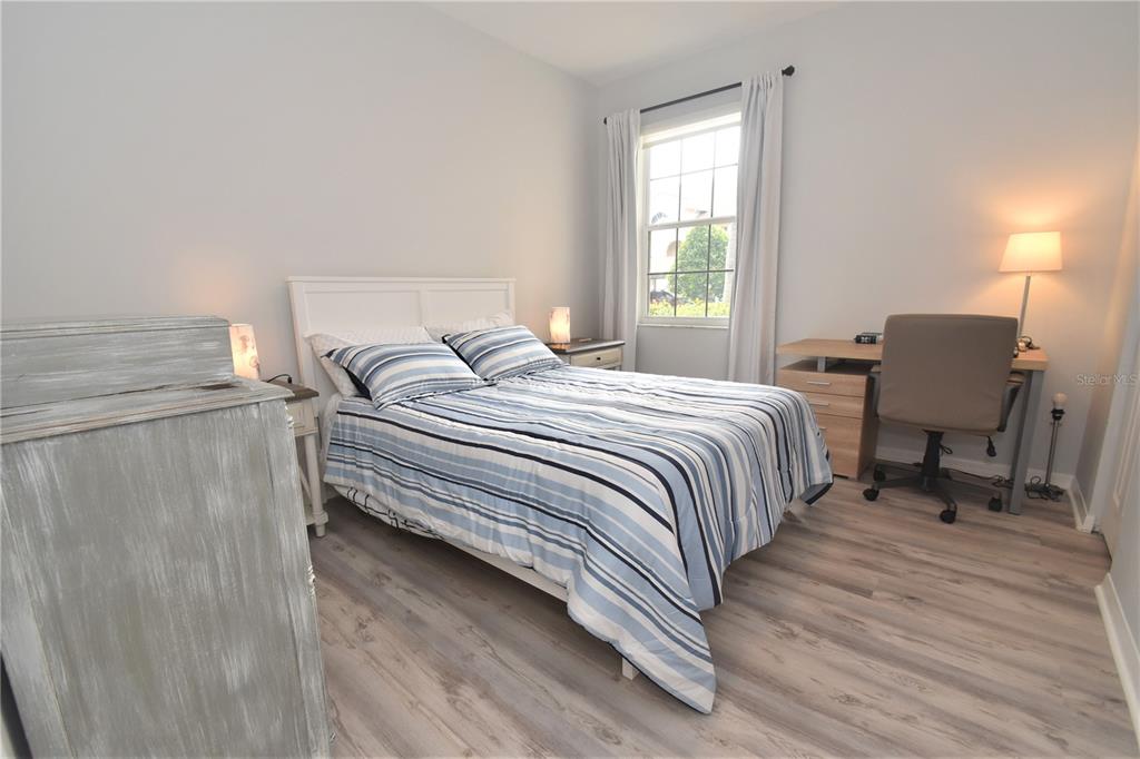 4235 Castle Bridge, Unit 1216 Sarasota, FL 34238 - Photo 8 of 18 a bedroom with a bed chair and a window